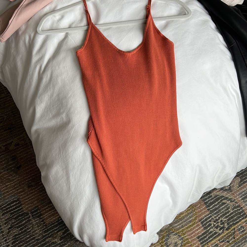 Rusty orange V-neck ribbed bodysuit with adjustable straps